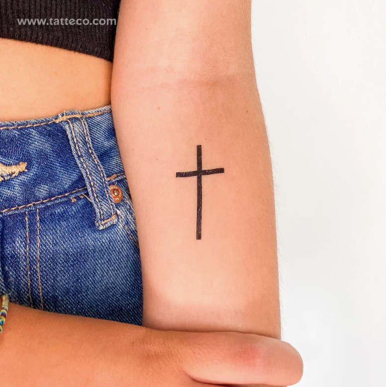 Minimalist Christian tattoos: Black minimal cross tattoo