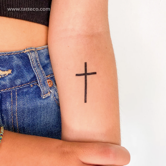 Minimalist Christian tattoos: Black minimal cross tattoo