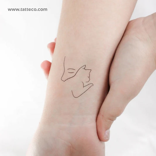 Emba: Cat woman tattoo
