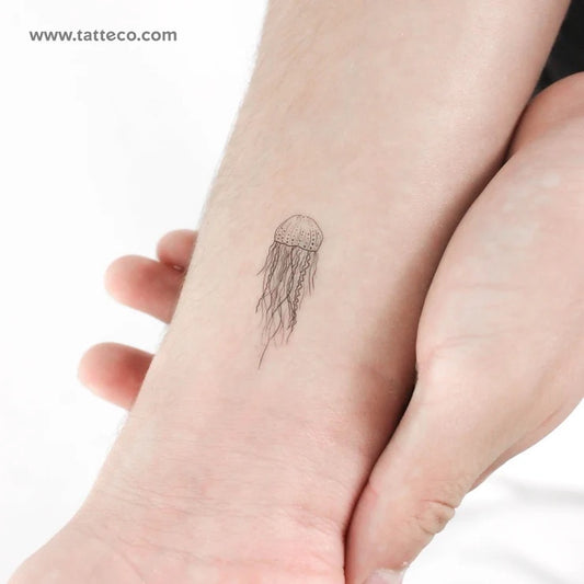 Jellyfish tattoos: fine-line feminine jellyfish tattoo