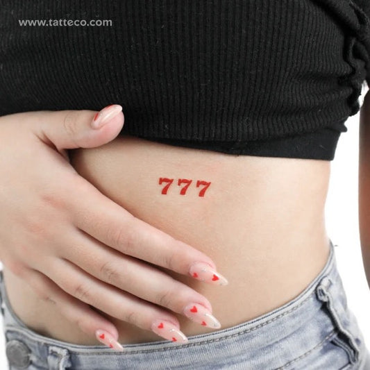 Red tattoos: 777 angel number tattoo
