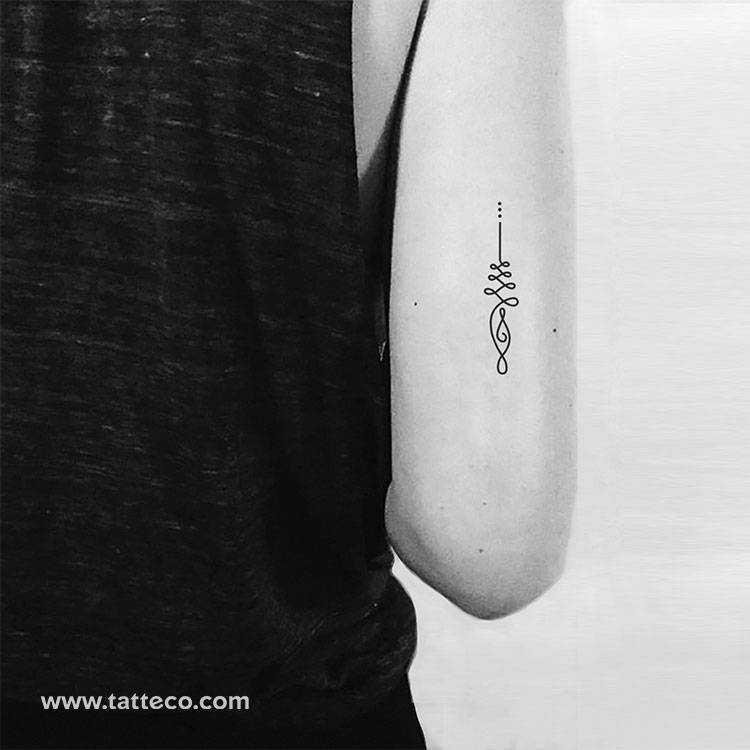 Understanding the Shared Symbolism of Om and Unalome Tattoos