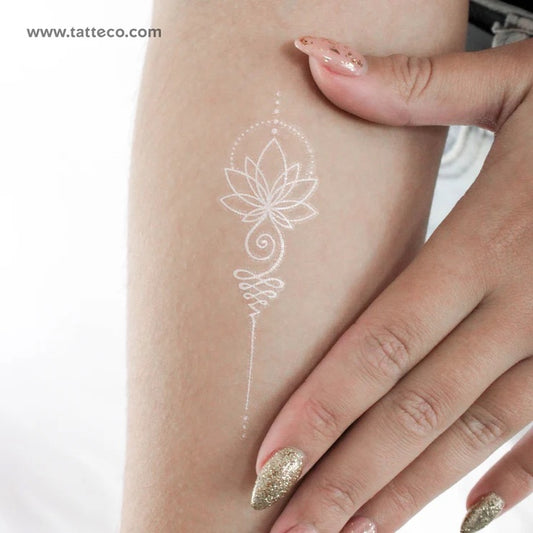 Yoga Tattoos: White fine-line unalome tattoo on arm